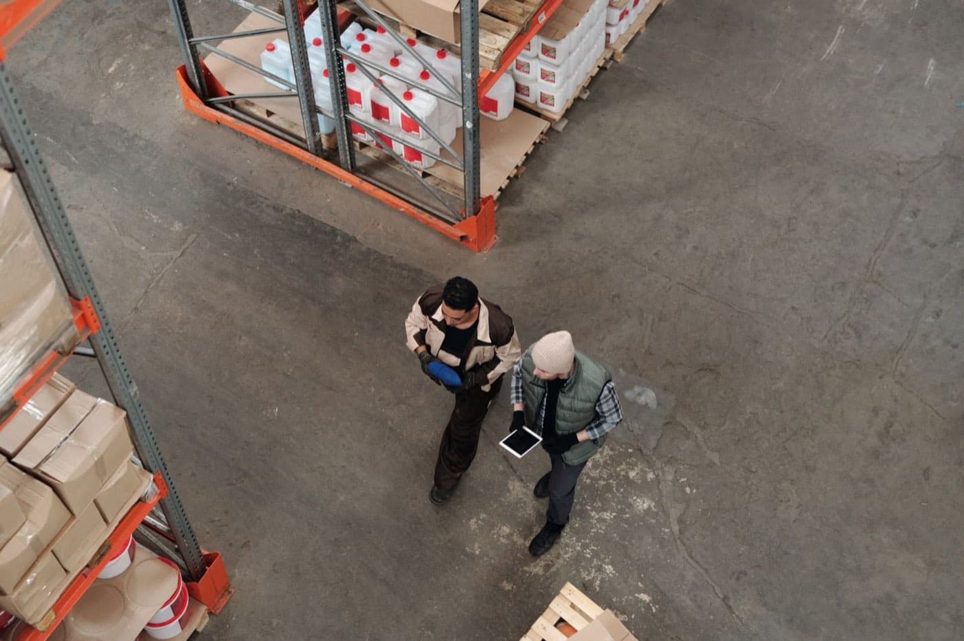 Warehouse worker checking pallets of inventory before a bulk export shipment